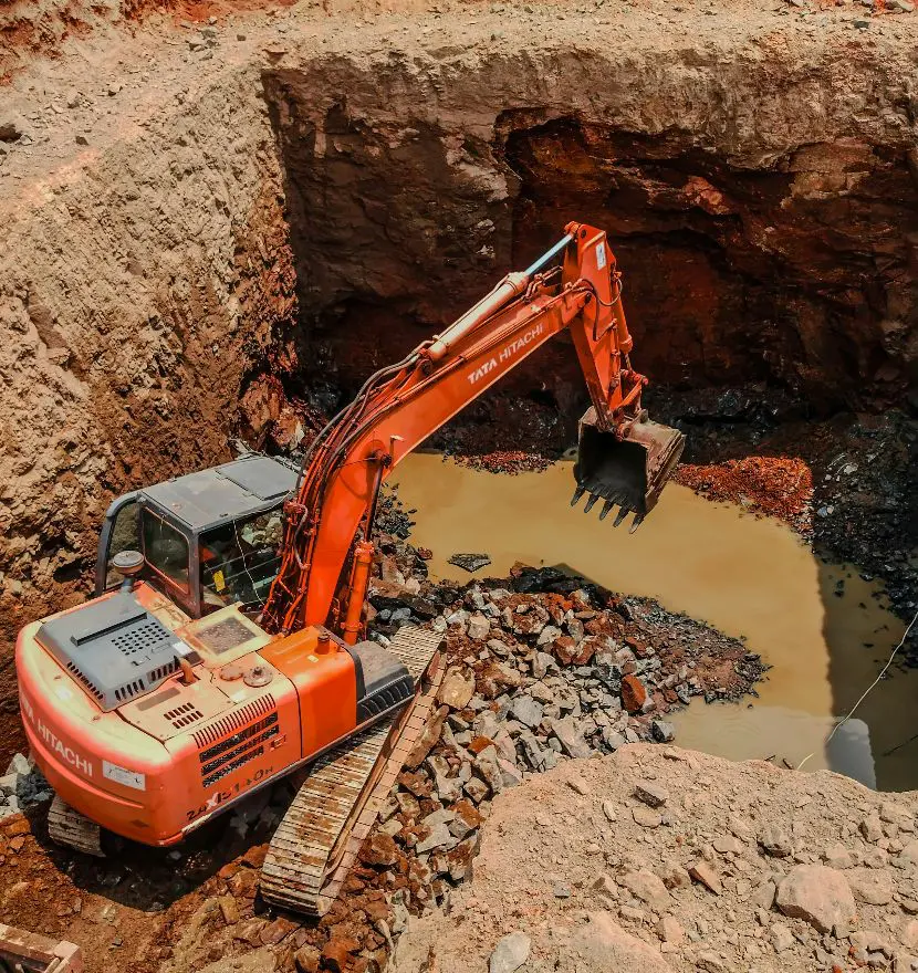 Grading crew leveling soil on a construction site in Boone, NC