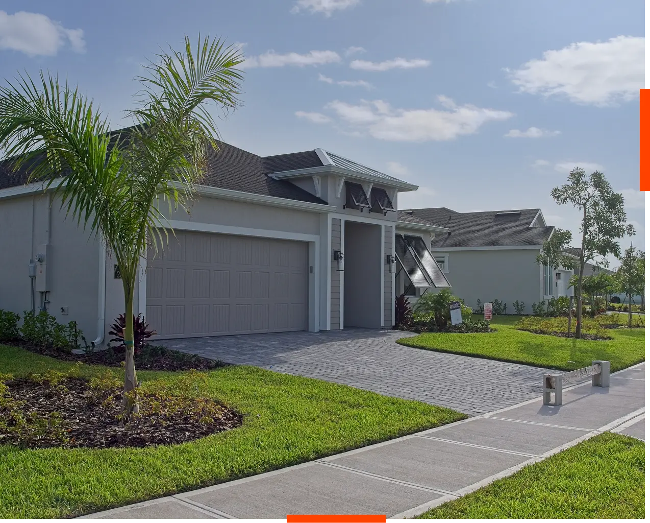 Modern suburban house with palm tree.