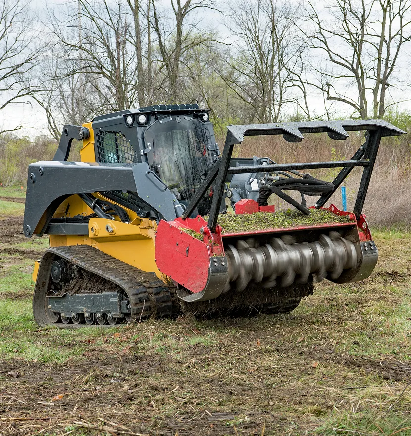Bulldozer with rotary cutter clearing land.