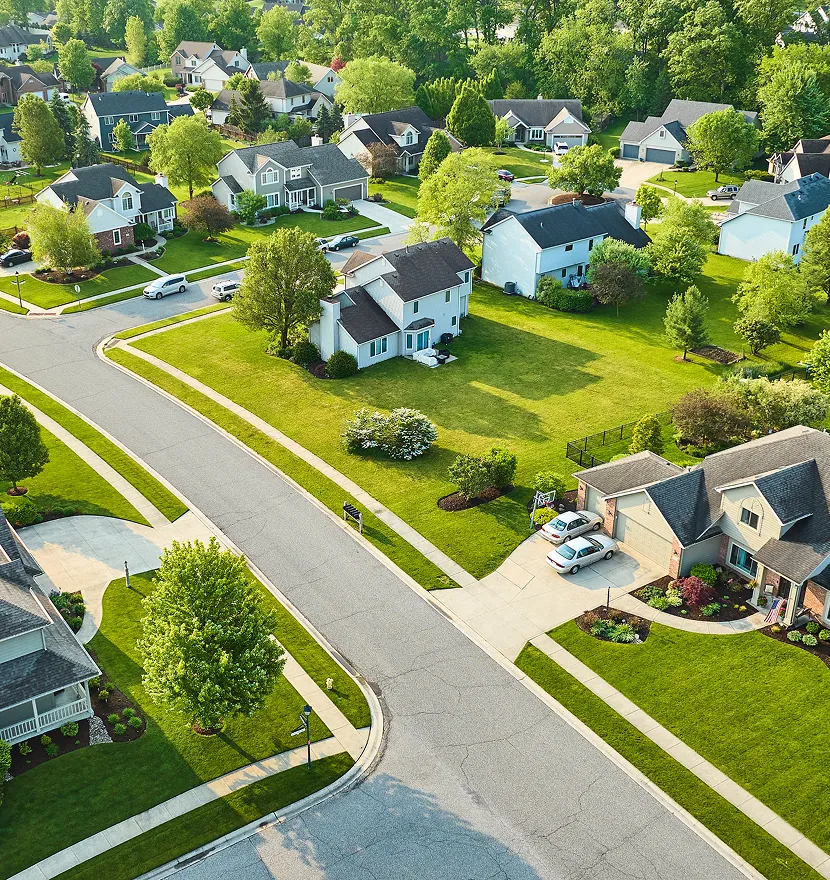 Suburban neighborhood with houses and greenery.